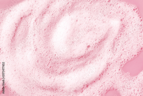 White skincare cleansing foam on light pink background