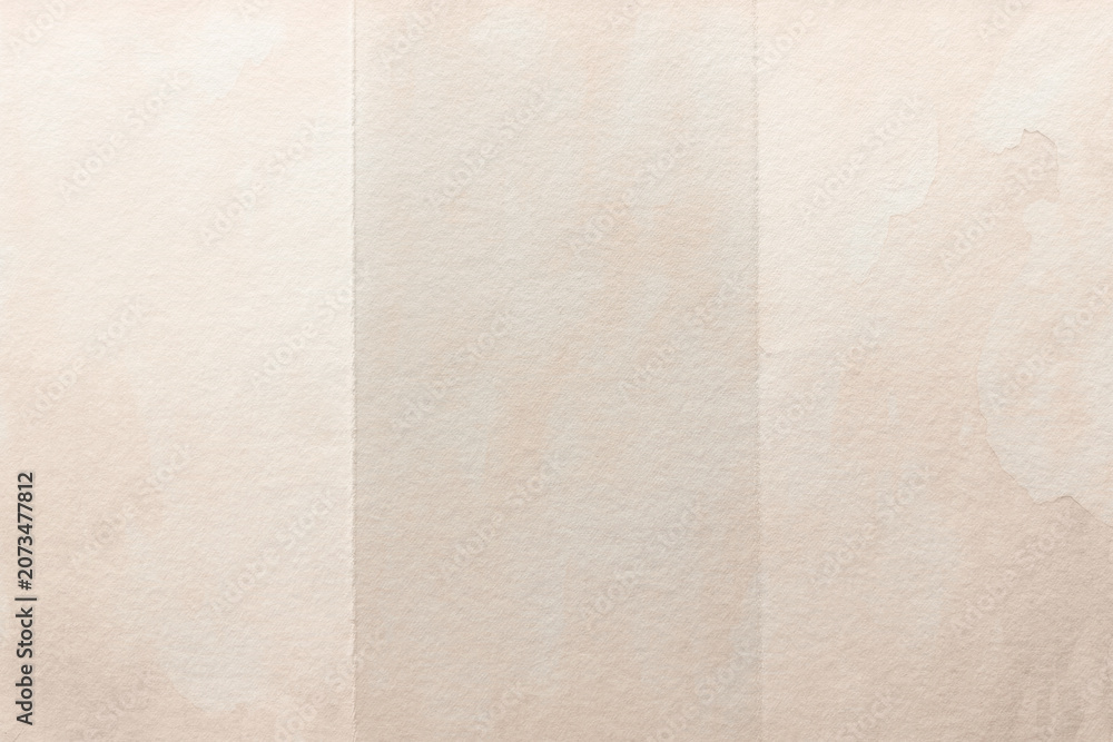 Fototapeta premium Subtle textured beige paper backdrop background