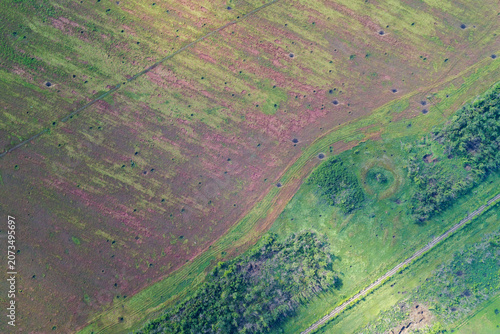 Obraz na plátně Scorched earth field with shell craters and global warming soil degradation terr