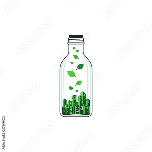 A glass bottle contains a miniature green city and floating leaves