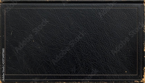 Black leather book cover with decorative border, vintage style, distressed texture