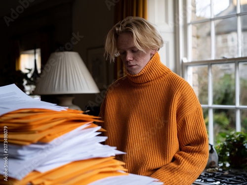 Stressed Man Surrounded by Paperwork – Work Pressure, Burnout, Anxiety and Overwhelming Office Workload