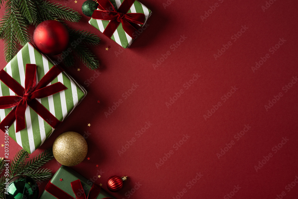 Obraz premium Christmas present and ornaments with Merry Christmas and Happy New Year message on red background