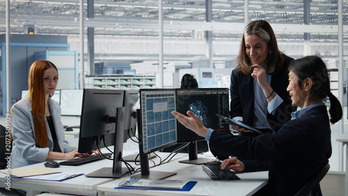 Fotografie Engineering team doing semiconductors prototyping with artificial intelligence in office, camera A