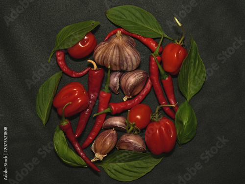 Fresh ripe tomatoes with garlic and basil ready for cooking