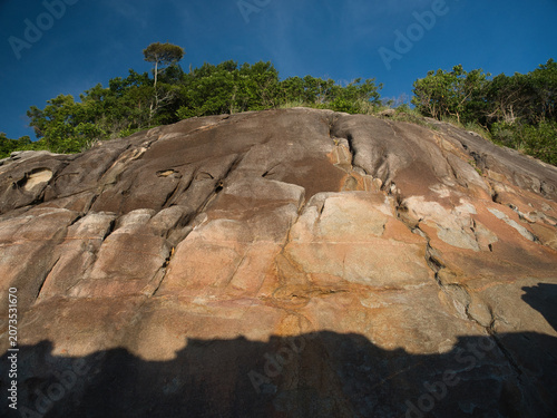 Canvas Print Large weathered granite rock formations with distinct slabs highlighted by lush vegetation clinging to the cliffs are a tourist attraction in khanom district nakhon si thammarat province