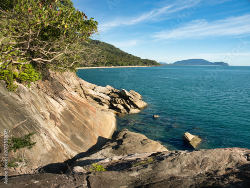 Obraz na plátne Large weathered granite rock formations with distinct slabs highlighted by lush vegetation clinging to the cliffs are a tourist attraction in khanom district nakhon si thammarat province
