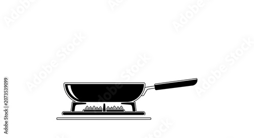 A black frying pan sitting on a lit gas stove burner.