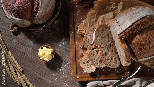 Sliced artisan sourdough bread on a wooden cutting board