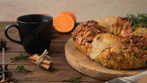 Traditional Bolo Rei Portuguese Christmas cake on a wooden board