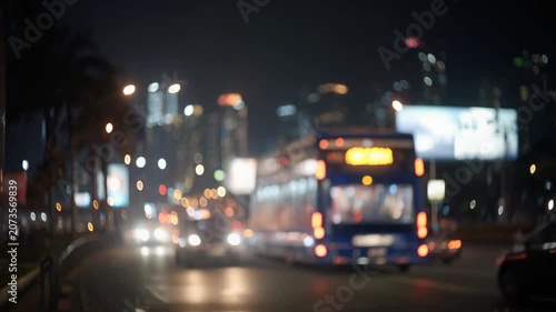 City lights at night traffic movement and illuminated buildings
