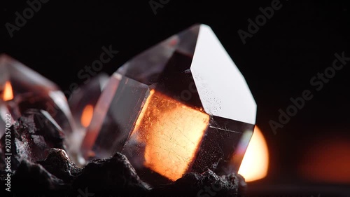 Close up of a clear crystal formation with dramatic lighting