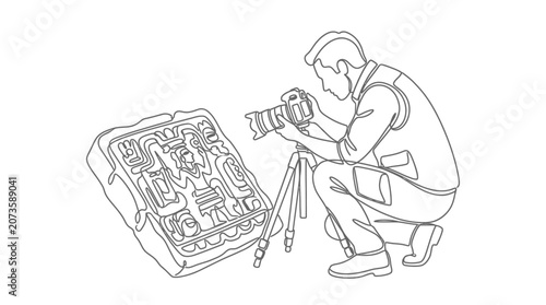 Fotografi Archaeologist photographs ancient stone carving with camera on tripod, documenting history