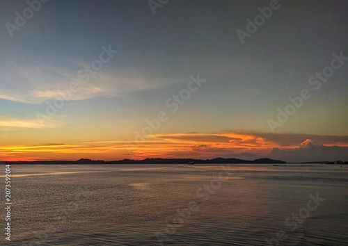 Peaceful Ocean Waves at Sunrise with Gentle Ripples and Calm Coastal Horizon