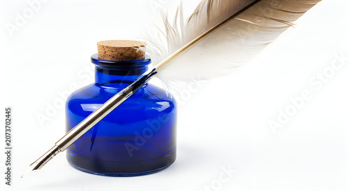 Antique blue inkwell with traditional feather quill pen on clean white surface.