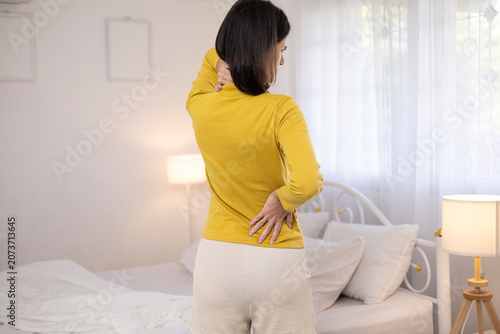 The young woman complained of lower back pain. She also experienced pain and stiffness in her shoulders, neck, and back, along with muscle spasms and general discomfort.