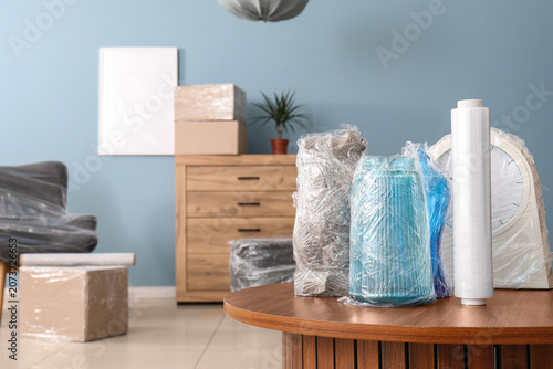 Принти на полотні Packed household items wrapped in plastic for moving