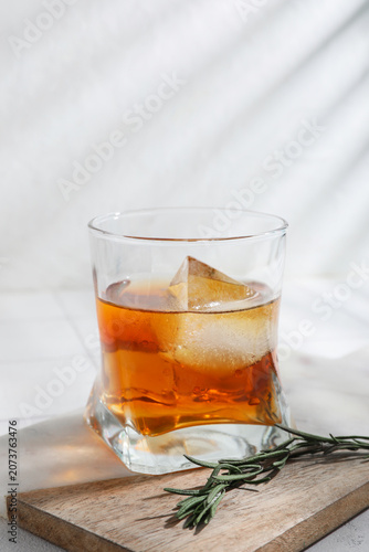 Glass of whiskey with ice c...