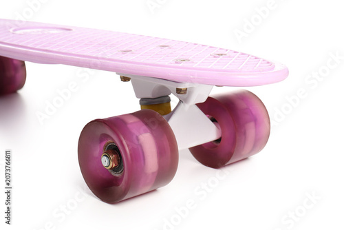 Pink skateboard on white ba...