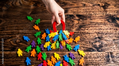 Magnet Attracting Diverse Colorful People Figures: Recruitment and Inclusion Concept