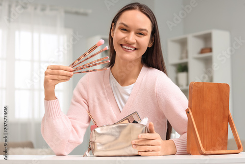 Young woman with makeup bru...