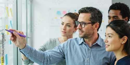 Business team brainstorming with colorful sticky notes in office