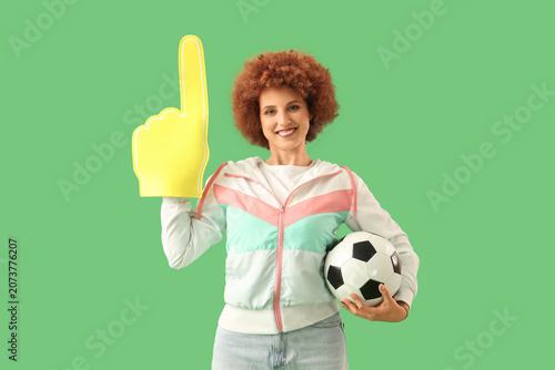 Female soccer fan with ball...