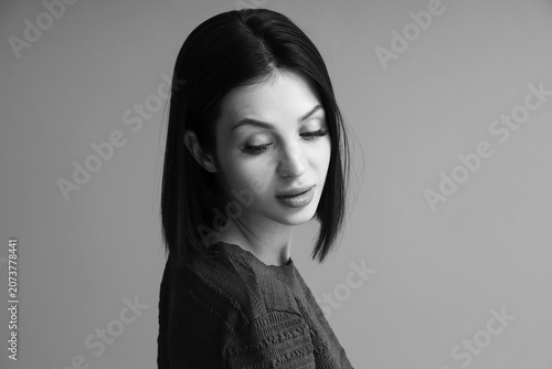 Black and white portrait of beautiful young woman with short hair