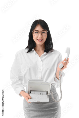 Young secretary with teleph...