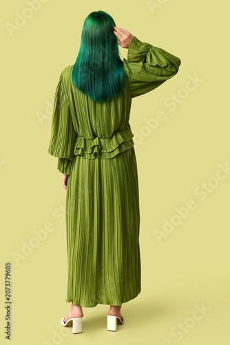 Young woman with green hair...