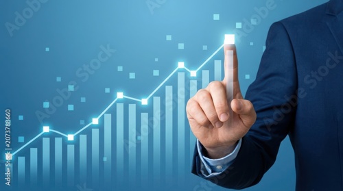 Businessman pointing to a growing graph a blue background squares