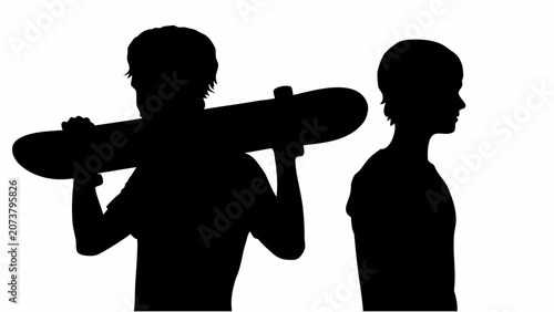 Fotografia Two boys in silhouette one carrying skateboard on shoulder