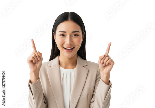Young asian woman, mid-20s, sharp beige blazer, points up enthusiastically with both fingers against a high-key white studio background with copy space. Concept of business recommendation