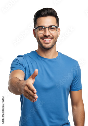Young hispanic man in a blue t-shirt and modern glasses offering a trusting handshake, medium close-up against a transparent studio background with copy space. Concept of professional partnership and