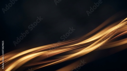 Vibrant golden light trails on a dark background with abstract motion blur effect in photography