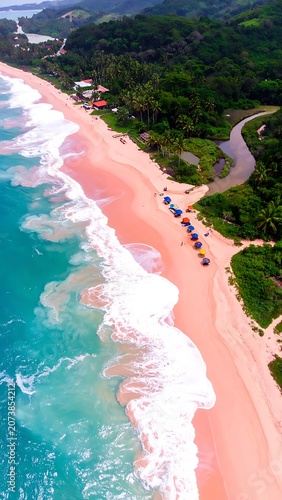 Aerial view of a pink sand beach.