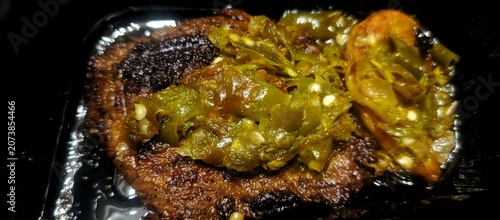 Photos Deliciously tender, moist beef jerky topped with green chili.