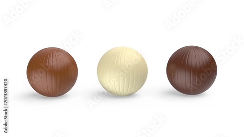 White, milk and dark chocolate balls on white background