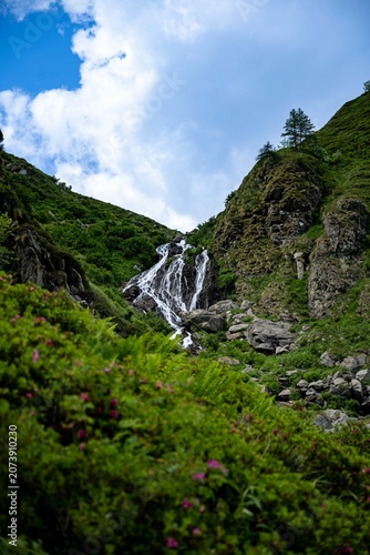mountain landscape in the alps with waterfall