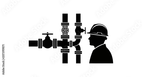 Fotografija Engineer wearing a hard hat examines complex industrial piping systems to ensure operational safety