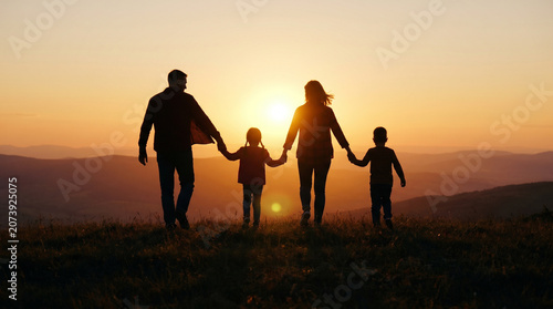 Family Bonding and Unity at Sunset Hiking Trip in Scenic Landscape Silhouetted Against a Majestic Sunset for Outdoor Adventure and Togetherness Concept
