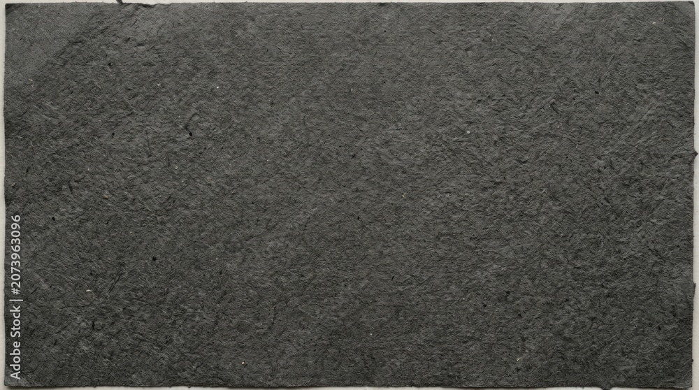 Fototapeta premium High Detail Monochrome Texture of Dark Rough Sandpaper Showing Granular Surface Patterns