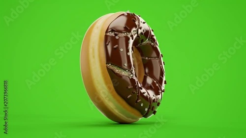 Closeup of Chocolate Donut with Sprinkles Rotating on Bright Green Background