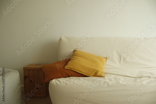 Comfortable sofa with colorful cushions and rustic accents