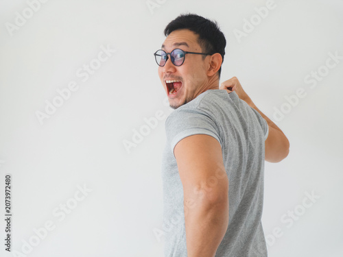 Spontaneous shot of cheerful Asian individual showcasing enthusiasm