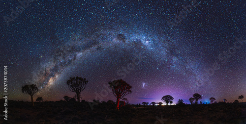 Breathtaking starry night sky with milky way and star trails in Namibia desert