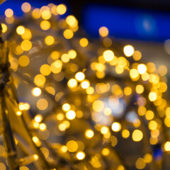 Abstract blurred yellow bokeh lights background for Christmas