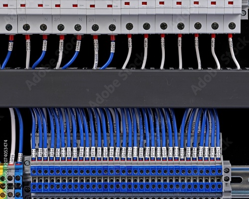 Marking electrical wiring wires with thermally printed nylon tape. 