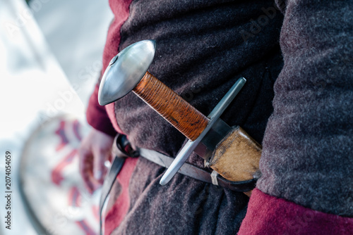 Canvas Print Medieval warrior carrying a sword and scabbard at a historical reenactment event