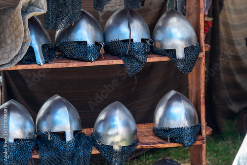 Konstfotografi Medieval helmets with chainmail on display at a historical reenactment event